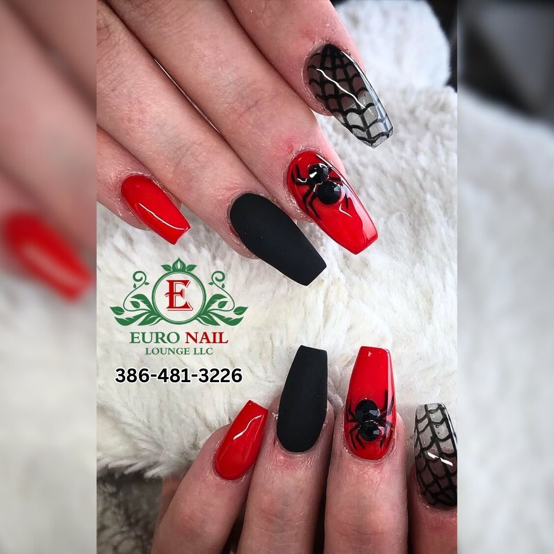 Spiderweb Halloween nails at Euro Nail Lounge — red and black coffin nails with spiderweb designs