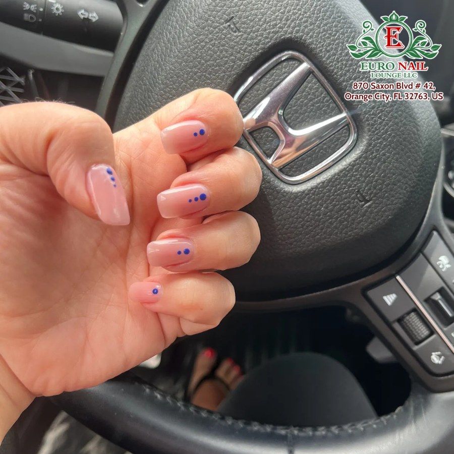Sheer pink dot nails at Euro Nail Lounge — sheer pink short coffin nails with blue dot accents