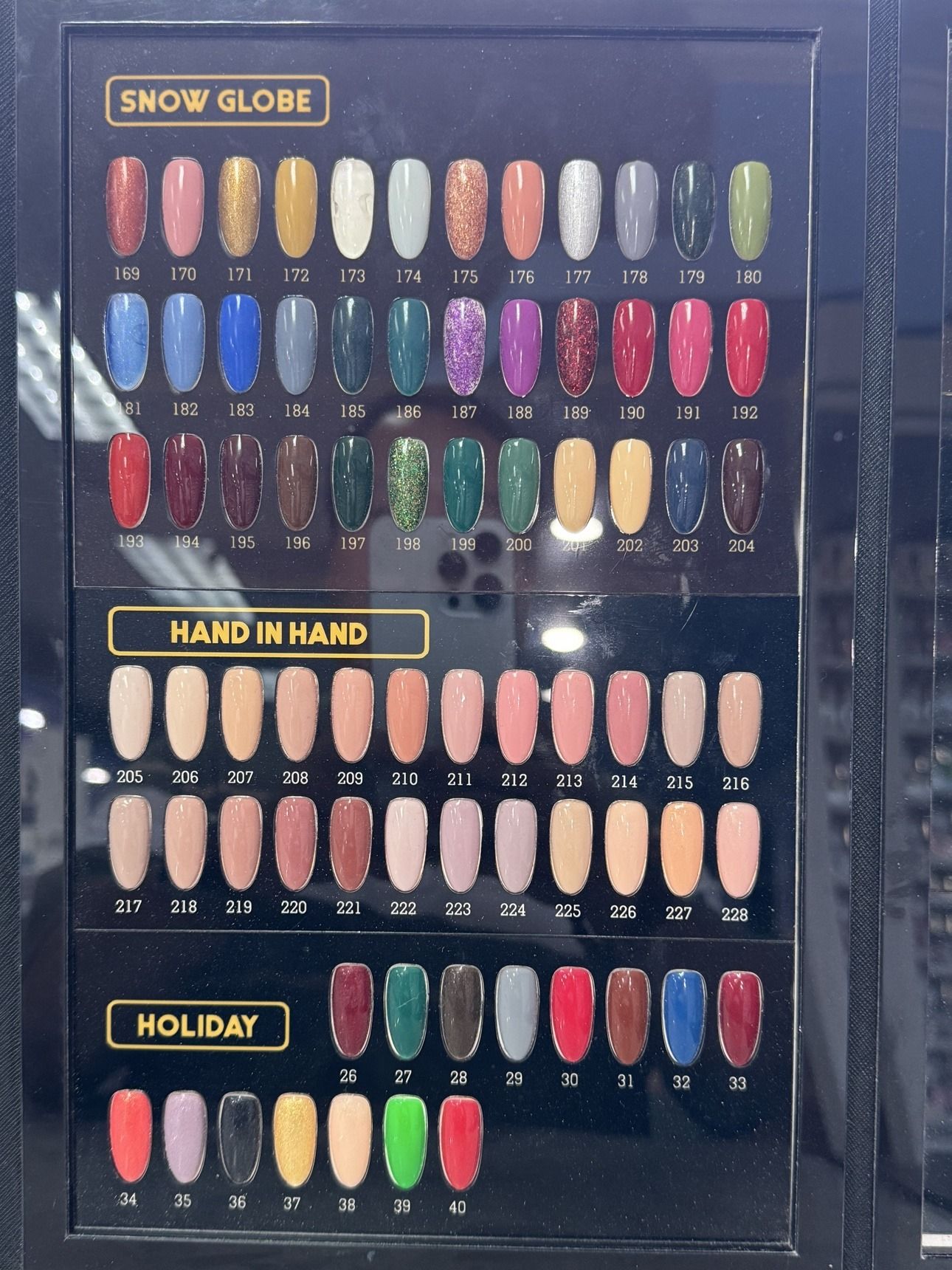 Solid Colors gel polish chart — Snow Globe shades 169 to 204, Hand in Hand shades 205 to 228, and Holiday shades 26 to 40
