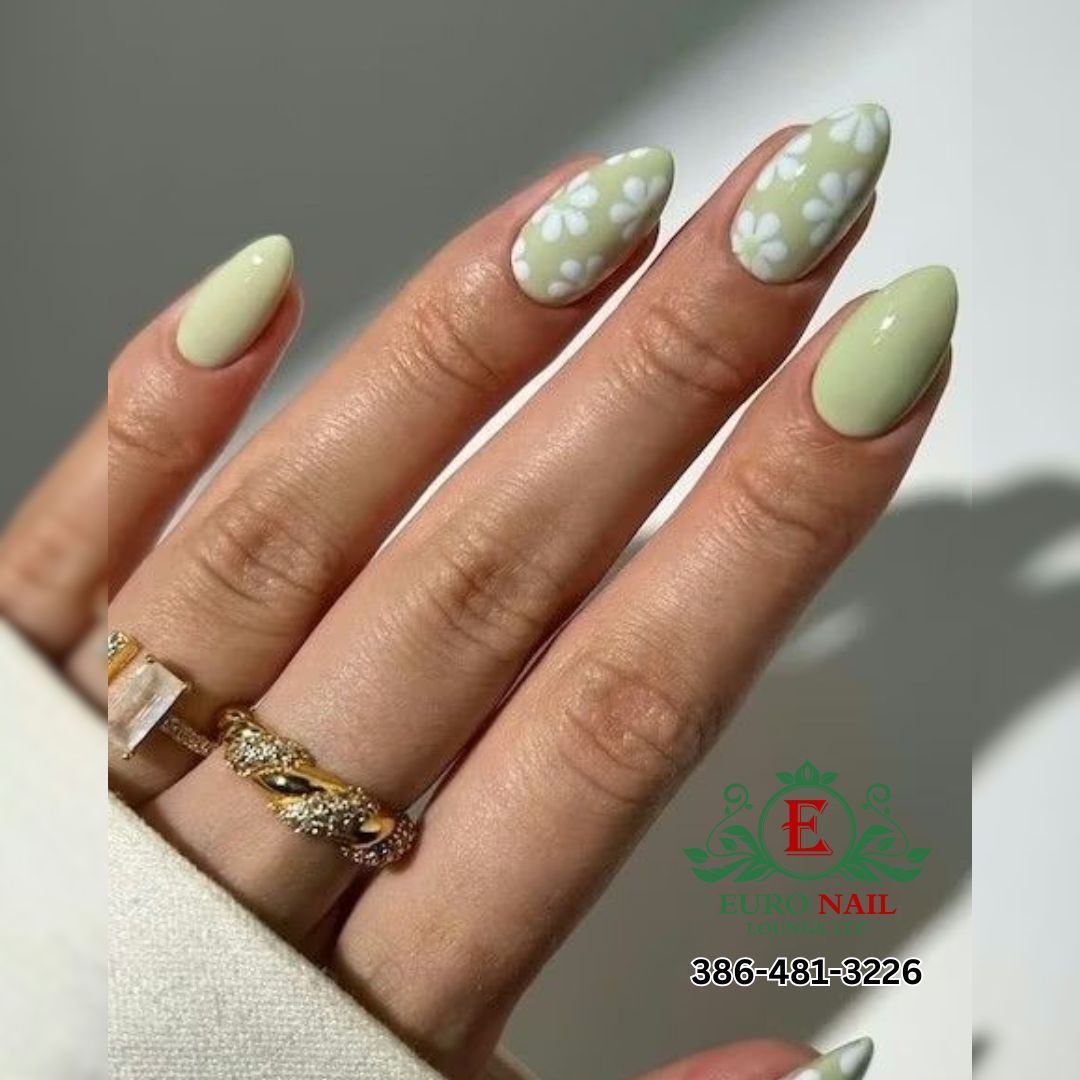 Sage green daisy nails at Euro Nail Lounge — sage green almond nails with white daisy designs